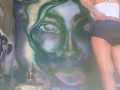 Girl with nice ass in booty shorts does graffiti