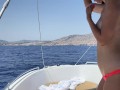 Brunette with big tits masturbates in the open sea on a boat