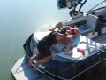 MILF getting her pussy licked on a boat in the middle of the lake