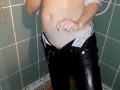 A chick in clothes under the shower. Wet panties, wet trousers, wet shirt. 2
