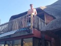 Bikini slut pissing from a balcony