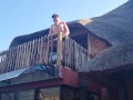 Bikini slut pissing from a balcony