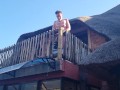 Bikini slut pissing from a balcony