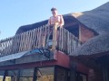 Bikini slut pissing from a balcony