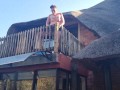 Bikini slut pissing from a balcony