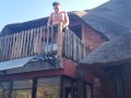 Bikini slut pissing from a balcony