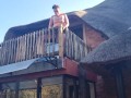 Bikini slut pissing from a balcony