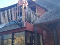 Bikini slut pissing from a balcony