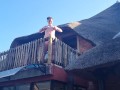 Bikini slut pissing from a balcony