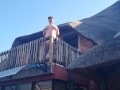 Bikini slut pissing from a balcony
