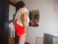 A naked lady does make-up in front of a mirror, puts on underwear, stockings, a skirt. 3