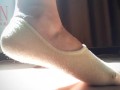 Fetish of feet, toes and socks. Cotton sneaker socks