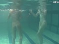 Russian lesbian girls swimming in the pool