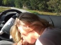 Milf sucking dick on the parking by the public road. Public cock sucking and cumshot