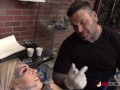 Sascha plays with Amber Luke while she gets tattooed