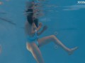 Petite Russian Marfa swims nude in the pool