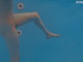 Petite Russian Marfa swims nude in the pool