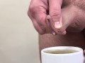Male pee in a cup