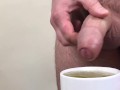 Male pee in a cup