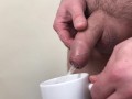 Male pee in a cup
