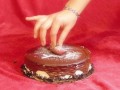 Kinky sweet girl sits down on a cake Foodporn