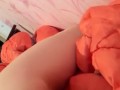 Masturbation squeezing a blanket between legs