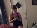 Pretty girl smoking in her night dress while watching tv