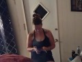 Pretty girl smoking in her night dress while watching tv