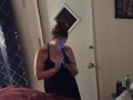 Pretty girl smoking in her night dress while watching tv