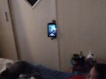 White cute milf in night dress smoking and watching TV