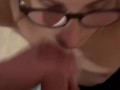 young with glasses gives a blowjob without hands