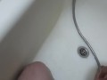 hot student washes in the shower and drains the piss while sitting