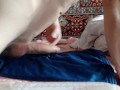 young handsome guy rubs against the bed and masturbates