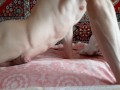 young handsome guy rubs against the bed and masturbates