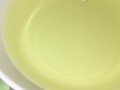 Girl pissing on plate over the toilet and doing an ovulation test