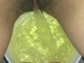 Girl pissing on plate over the toilet and doing an ovulation test