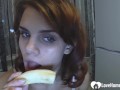 Brunette babe show's her sucking skills on banana