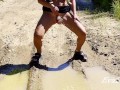 sexy blonde pissing in a puddle on the road