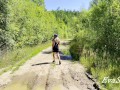 sexy blonde pissing in a puddle on the road