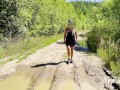 sexy blonde pissing in a puddle on the road