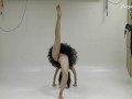 Russian brunette acrobat stretching her sexy long legs