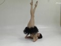 Russian brunette acrobat stretching her sexy long legs