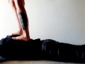 Trampling. Dominatrix Nika walks on the back of her slave with bare feet