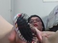 punching a brush in the pussy