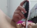 punching a brush in the pussy