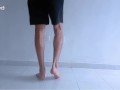 Long legs and sexy feet doing squats while stripping