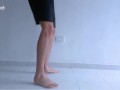 Long legs and sexy feet doing squats while stripping