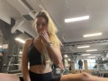 Naughty girl flashing tits in gym right next to the men’s company. Public.