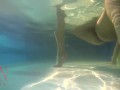Elegant and flexible babe, swimming underwater in the outdoor swimming pool. 3 1