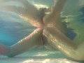 Elegant and flexible babe, swimming underwater in the outdoor swimming pool. 3 1
